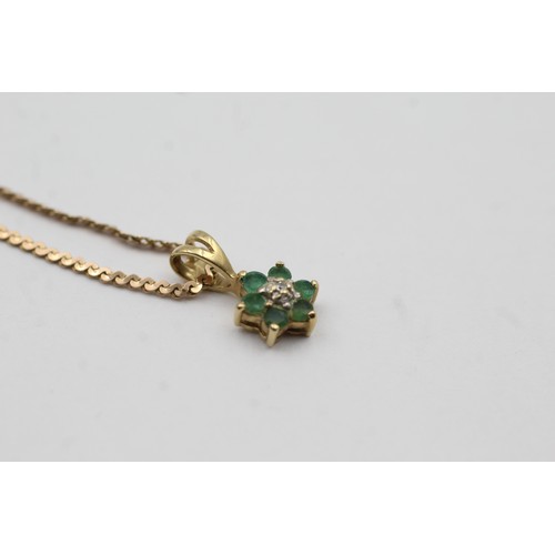 488 - 9ct gold emerald and diamond floral drop pendant on chain (2.6g)