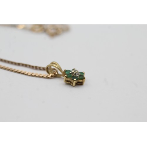 488 - 9ct gold emerald and diamond floral drop pendant on chain (2.6g)