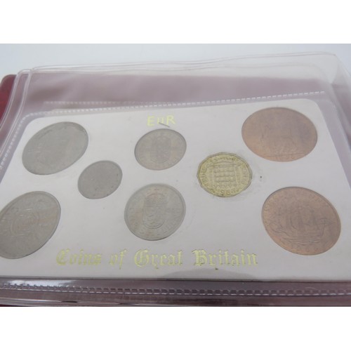 242 - ALBUM OF COINS OF GREAT BRITAIN SETS AND FOUR BRITAINS FIRST DECIMAL COIN SETS