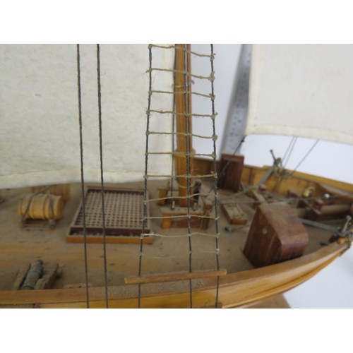 99 - LARGE SCALE MODEL WOODEN SAILING BOAT ON A WOODEN DISPLAY STAND LENGTH 38