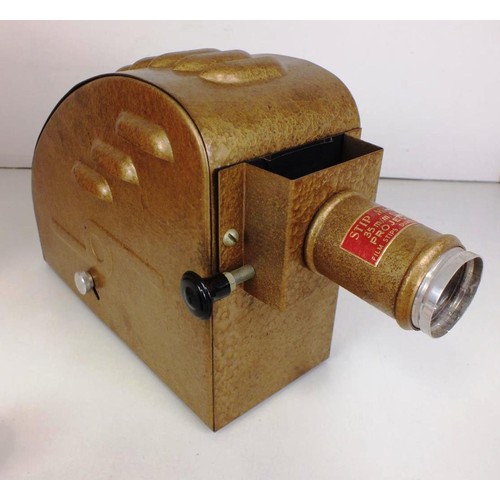 101 - A Stip Master 35mm film strip projector, and a collection of film strips including Disney