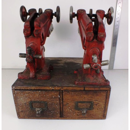 81 - Mid 20th Century cobbler's equipment - two shoe stretchers/vices and a two drawer cabinet containing... 