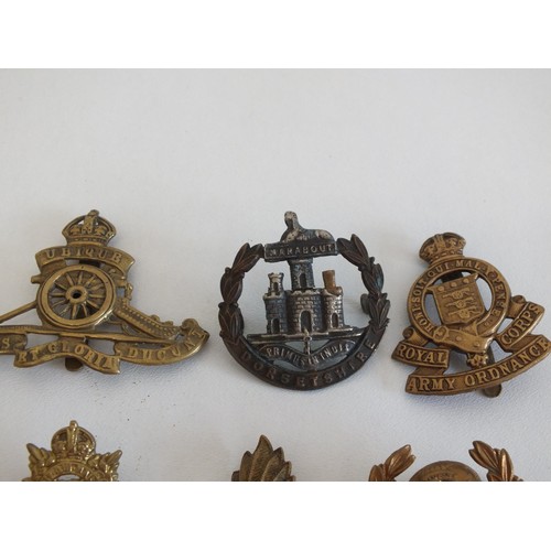 84 - TEN MILITARY BADGES INCLUDING CAP BADGES