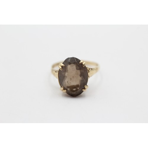 498 - 9ct Gold Oval Cut Smoky Quartz Solitaire Statement Ring (2.3g) - Size N