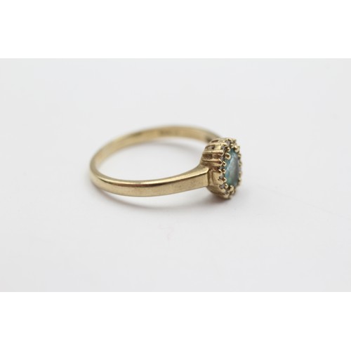 512 - 9ct Gold Diamond And Topaz Oval Halo Cluster Ring (2.3g) - Size P