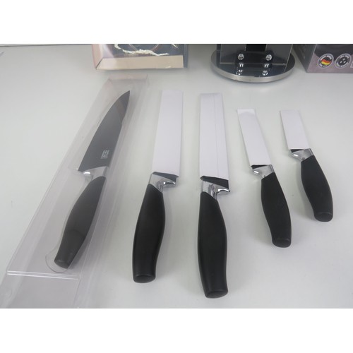 186 - CUISINE PRO 6 PIECE KNIFE SET (MISSING 1 KNIFE) BOXED AND TOWEL HOLDER