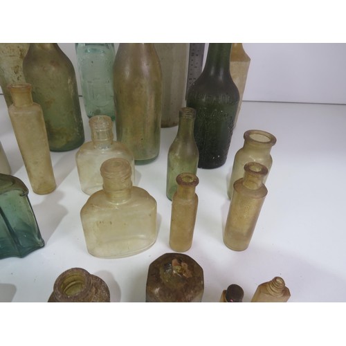 349 - COLLECTION OF OLD BOTTLES INCLUDES WAKEFIELD STONEWARE BOTTLE,THOMAS BARKER PONTEFRACT MARBLE COD BO... 