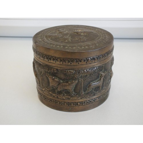 269 - ROUND COLONIAL INDIAN SILVER BOX WITH FIGURAL WORK DEPICTING DIFFERENT ANIMALS INCLUDING ELEPHANTS, ... 