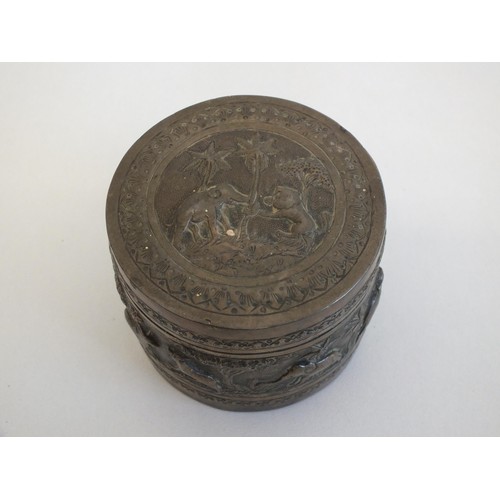 269 - ROUND COLONIAL INDIAN SILVER BOX WITH FIGURAL WORK DEPICTING DIFFERENT ANIMALS INCLUDING ELEPHANTS, ... 