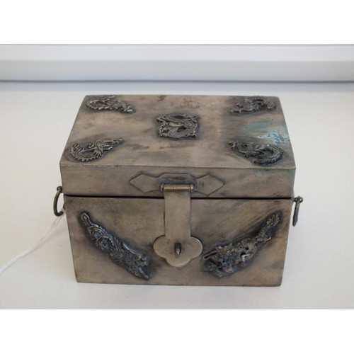 268 - CHINESE SILVER TRINKET BOX WITH DRAGON & BIRD MOTIFS AND TWO RING HANDLES, IMPRESSED MARK TO THE BAS... 