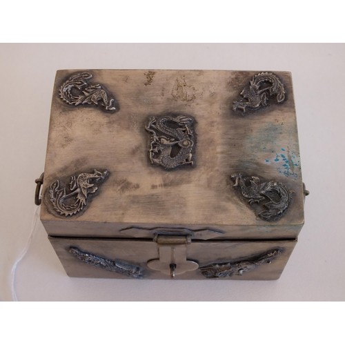 268 - CHINESE SILVER TRINKET BOX WITH DRAGON & BIRD MOTIFS AND TWO RING HANDLES, IMPRESSED MARK TO THE BAS... 