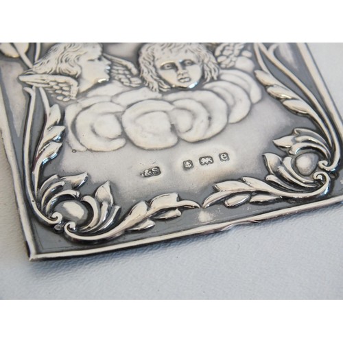 233 - ORNATE 1916 STERLING SILVER PHOTOGRAPH FRAME 12cms x 9cms and STERLING SILVER CHERUB BOOK COVER