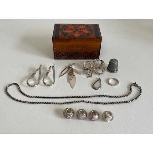 397 - SMALL WOODEN TRINKET BOX FULL OF SILVER ITEMS OF JEWELLERY INCLUDING SILVER CHARMS