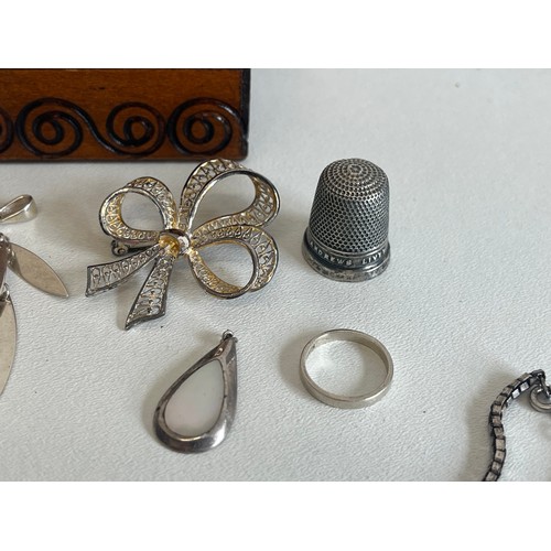 397 - SMALL WOODEN TRINKET BOX FULL OF SILVER ITEMS OF JEWELLERY INCLUDING SILVER CHARMS