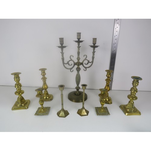 371 - BRASS CANDLEABRA AND FOUR PAIRS OF BRASS CANDLESTICKS