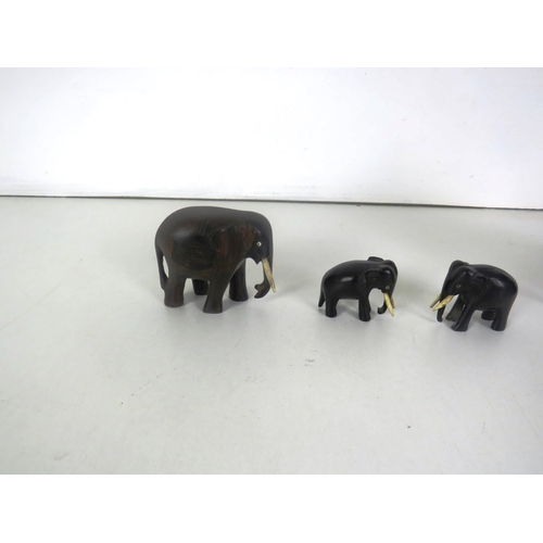 84 - SET OF FOUR CARVED WOODEN ELEPHANTS