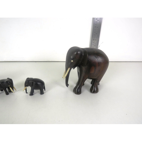 84 - SET OF FOUR CARVED WOODEN ELEPHANTS