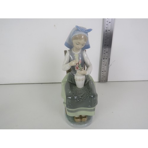 92 - TWO LLADRO FIGURES- GIRL SITTING ON CHAIR WITH VASE OF FLOWERS AND RABBIT EATING LEAVES