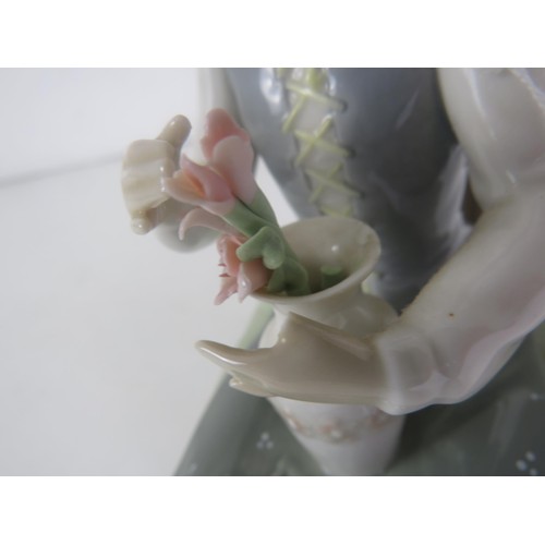 92 - TWO LLADRO FIGURES- GIRL SITTING ON CHAIR WITH VASE OF FLOWERS AND RABBIT EATING LEAVES