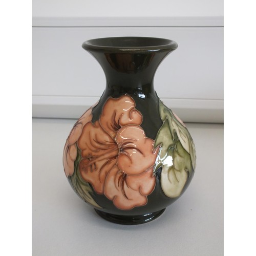 86 - MOORCROFT HIBISCUS PATTERN VASE ARROW 1990 IMPRESSED MARK ON BASE- HEIGHT 14cms