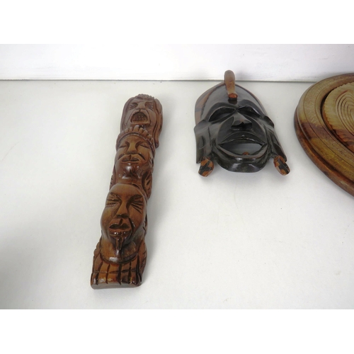 267 - TREEN ITEMS INCLUDES COLLAPSIBLE WOODEN PAISLEY CARVED BASKET, TRIBAL MASK, WALL PLAQUES ETC