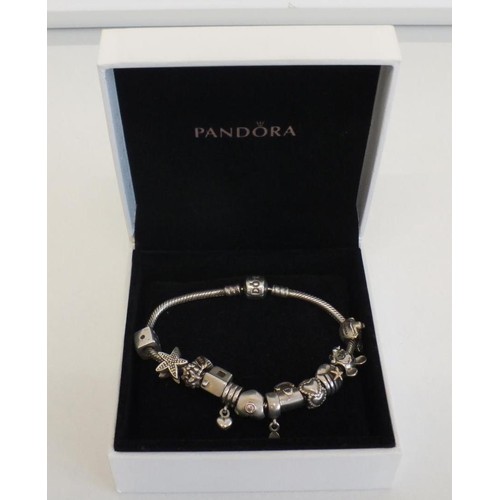 231 - GENUINE PANDORA BRACELET WITH 12 PANDORA CHARMS INCLUDES DISNEY MINNIE & MICKEY MOUSE & SILVER SHELL... 