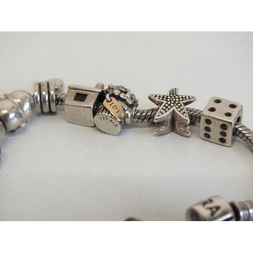 231 - GENUINE PANDORA BRACELET WITH 12 PANDORA CHARMS INCLUDES DISNEY MINNIE & MICKEY MOUSE & SILVER SHELL... 