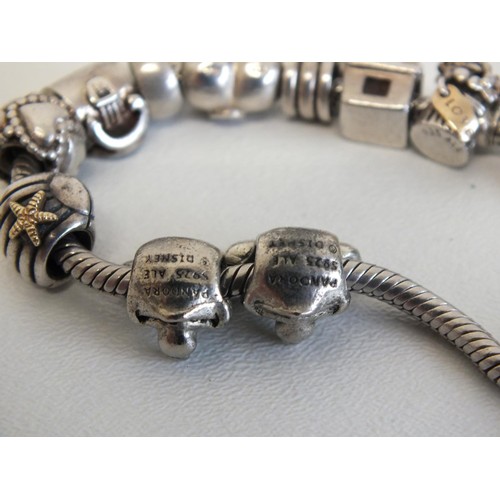 231 - GENUINE PANDORA BRACELET WITH 12 PANDORA CHARMS INCLUDES DISNEY MINNIE & MICKEY MOUSE & SILVER SHELL... 