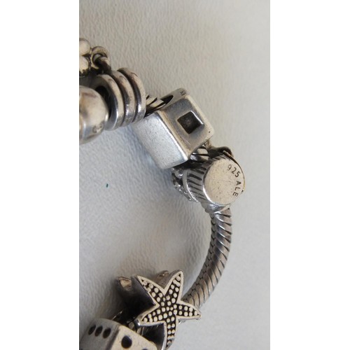 231 - GENUINE PANDORA BRACELET WITH 12 PANDORA CHARMS INCLUDES DISNEY MINNIE & MICKEY MOUSE & SILVER SHELL... 