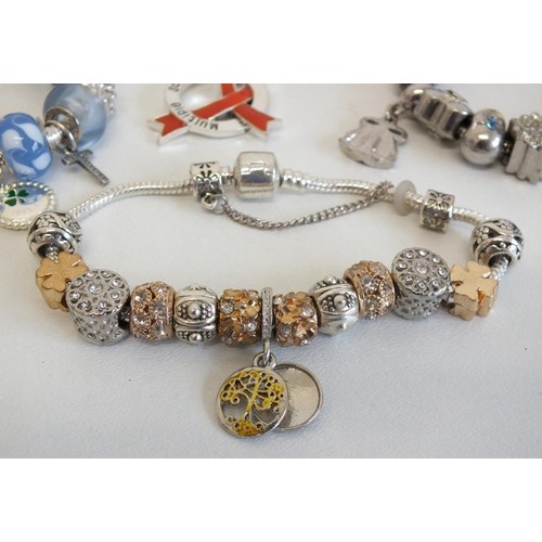 240 - 7 ASSORTED FASHION CHARM BRACELETS