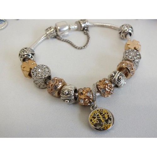 240 - 7 ASSORTED FASHION CHARM BRACELETS