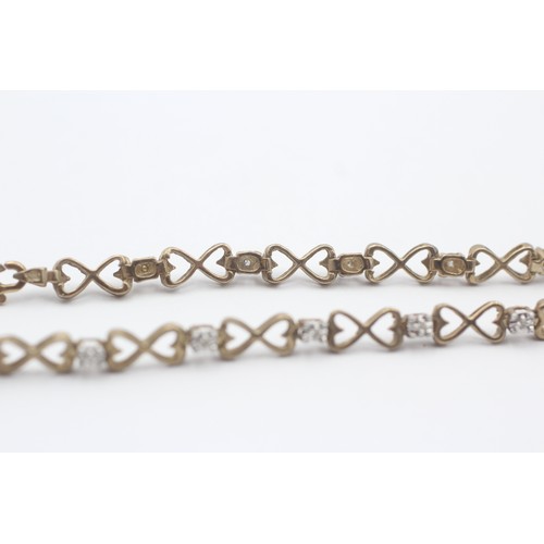 406 - 9ct White And Yellow Gold Diamond And Openwork Heart Links Fancy Chain Bracelet (4.3g)