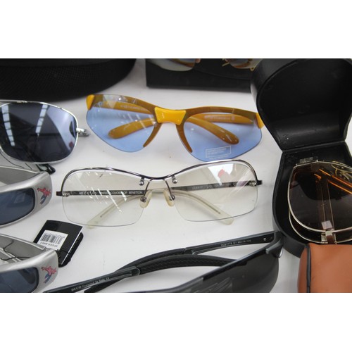 441 - 25 x Assorted SPORTS STYLE Sunglasses Inc Bloc, Bolle, Maui Jim etc