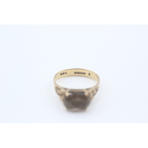 454 - 9ct Gold Smoky Quartz Oval Cut Textured Shoulders Solitaire Ring (2.6g) - Size P