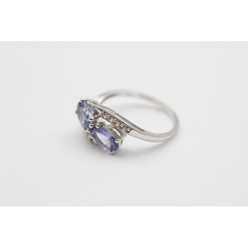 547 - 9ct White Gold Diamond And Tanzanite Toi & Moi Two Stone And Bypass Shoulders Set (2g) - Size M