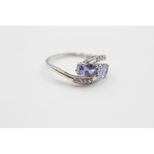 547 - 9ct White Gold Diamond And Tanzanite Toi & Moi Two Stone And Bypass Shoulders Set (2g) - Size M