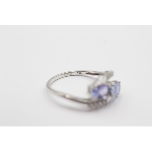 547 - 9ct White Gold Diamond And Tanzanite Toi & Moi Two Stone And Bypass Shoulders Set (2g) - Size M