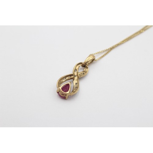 568 - 9ct White And Yellow Gold Diamond And Ruby Teardrop Ribbon Drop Pendant Necklace (1.6g)