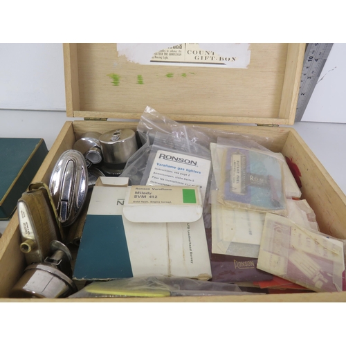 136 - QUANTITY OF LIGHTER SPARE PARTS, CASES, POUCHES AND PAPERWORK