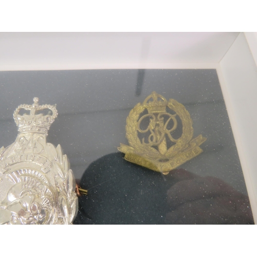175 - PAIR OF FRAMED CAP BADGES AND WWII MEDALS