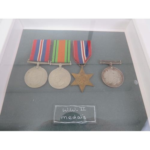 175 - PAIR OF FRAMED CAP BADGES AND WWII MEDALS