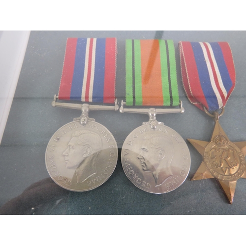 175 - PAIR OF FRAMED CAP BADGES AND WWII MEDALS