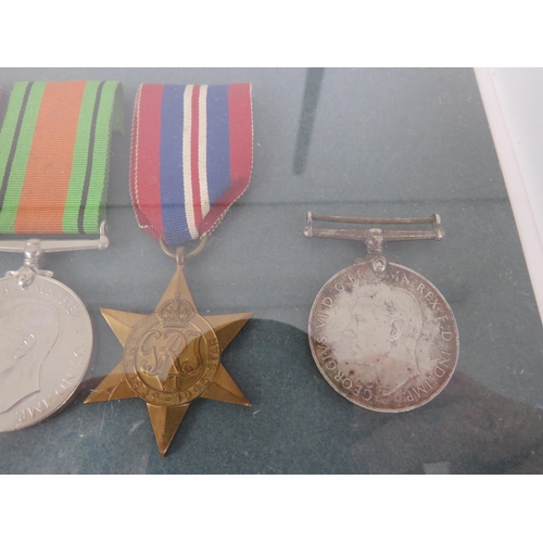 175 - PAIR OF FRAMED CAP BADGES AND WWII MEDALS
