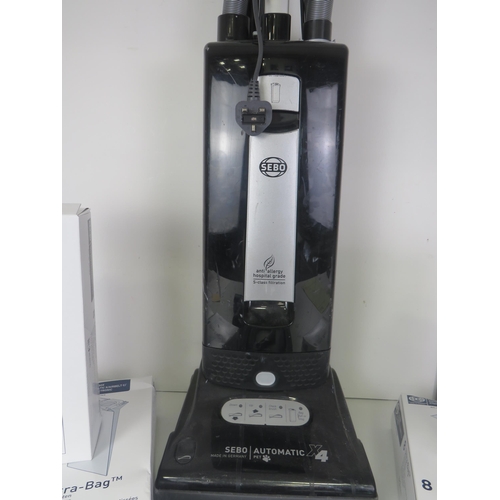 311 - SEBO AUTOMATIC HOOVER WITH ATTACHMENTS and 8 BOXES OF ULTRABAGS