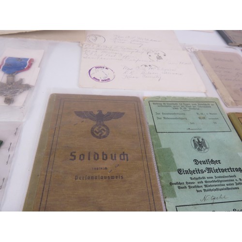 62 - TRAY OF MILITARIA INCLUDES MEDALS, PHOTOGRAPHS, BADGES, BOOKLETS ETC