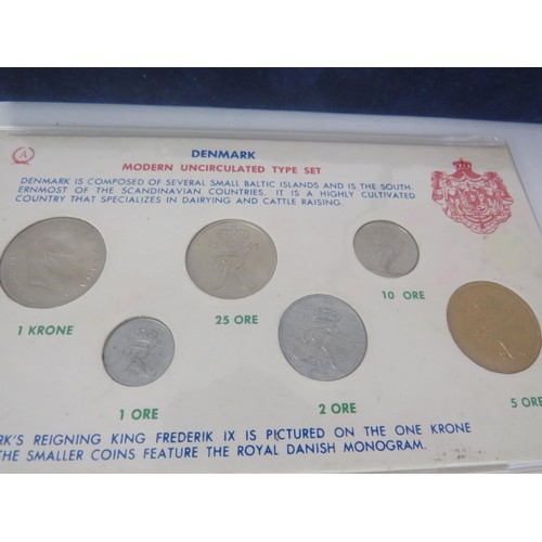 64 - COLLECTORS COINS INCLUDES CHINA COMMEMORATIVE COIN COLLECTION, DENMARK COVER COINS AND COIN SET etc