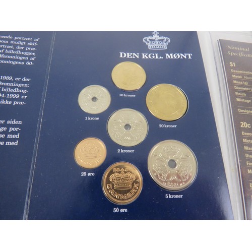 64 - COLLECTORS COINS INCLUDES CHINA COMMEMORATIVE COIN COLLECTION, DENMARK COVER COINS AND COIN SET etc