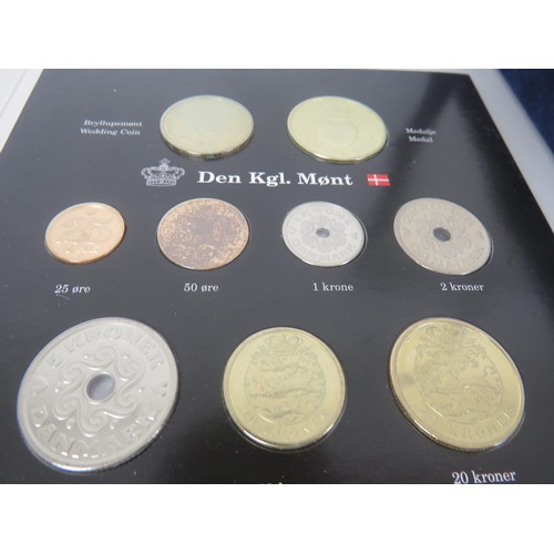 64 - COLLECTORS COINS INCLUDES CHINA COMMEMORATIVE COIN COLLECTION, DENMARK COVER COINS AND COIN SET etc