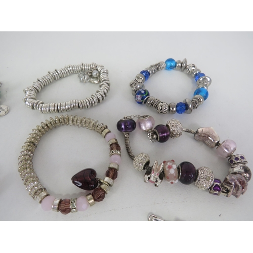 209 - SELECTION OF FASHION CHARM BRACELETS AND NECKLACES