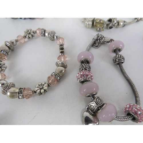 209 - SELECTION OF FASHION CHARM BRACELETS AND NECKLACES